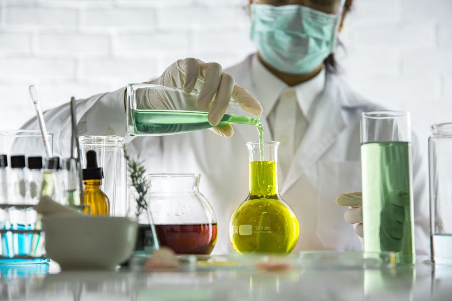 lab person with chemicals